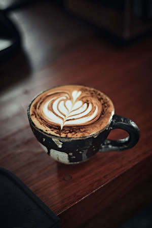 Selective focus cup of hot latte art coffee,focus at white foamの写真素材