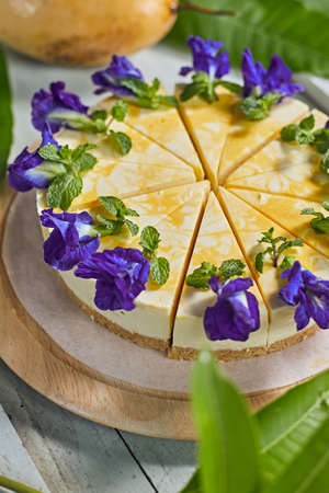 mango cheese cake on wood background,selective focusの写真素材