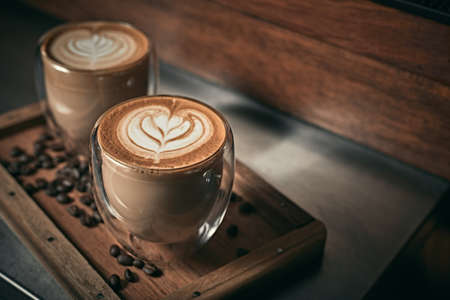 Selective focus cup of hot latte art coffee,focus at white foamの写真素材