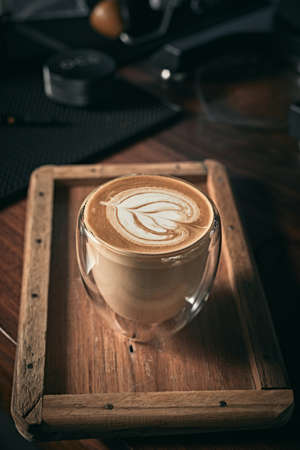Selective focus cup of hot latte art coffee,focus at white foamの写真素材