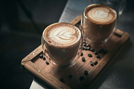 Selective focus cup of hot latte art coffee,focus at white foamの写真素材