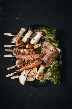 Japanese grill barbecue  (yakitori) on dark background.
