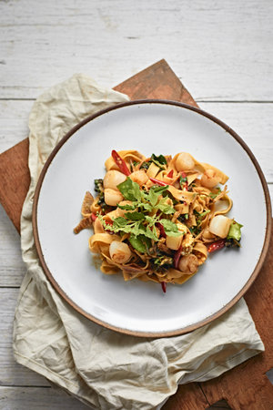 Stir Fried Spicy pasta with Scallop,selective focus