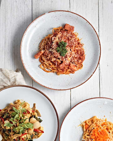 Plate with tasty pasta on white background,topviewの写真素材
