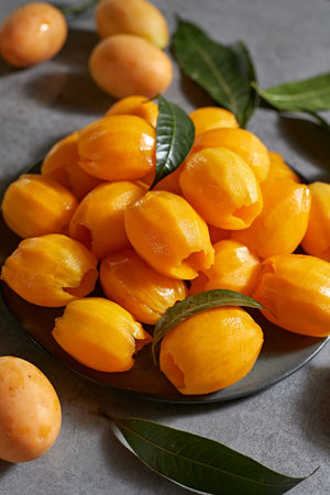Fresh sweet marian plum on background, selective focusの写真素材