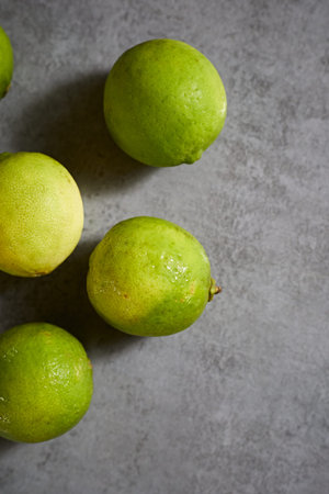 Close up lime on gray background, selective focus