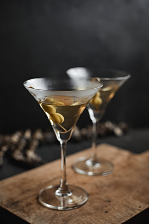 Martini cocktail with green olives, selective focusの写真素材