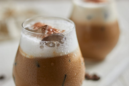 Iced cappuccino and milk foam, selective focus