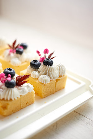 mini butter cake with whipped cream, selective focus