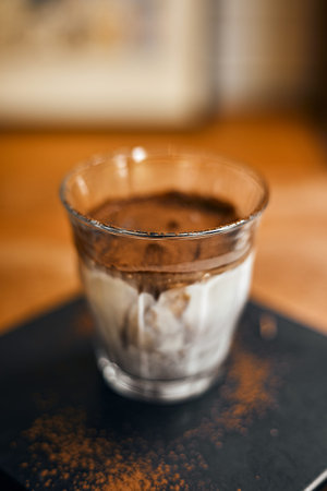 Dirty coffee,Cold milk topped with hot espresso shot.selective focus