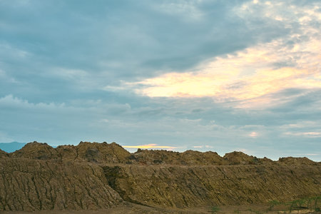 Mud barren landÂ with rainy sky.