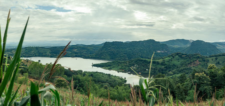 Beautiful view of Mae Suai reservoir (or Dammed valleys) located at a narrow part of a valley downstream of a natural basin in Mae Suai district of Chiang Rai province of Thailand.の写真素材