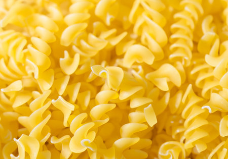 Close up  raw pasta shapes and forms background.の素材