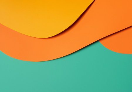 Orange and yellow sheets of paper on green backgroundの素材