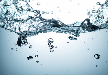 Close up of water splashing on white backgroundの素材