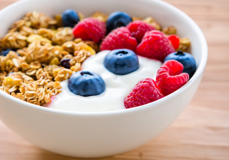 Yogurt bowl with granola and berries, selective focusの素材