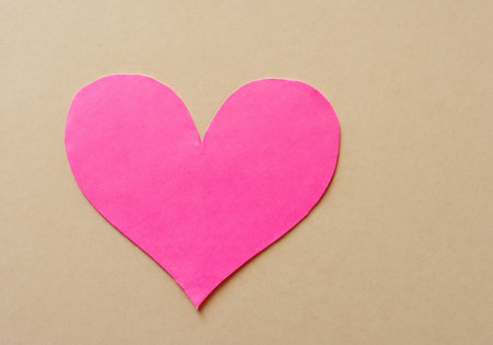 Paper heart shape on pastel background.の素材