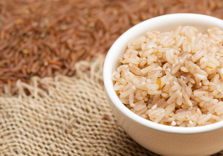 Close up of brown rice in cupの素材