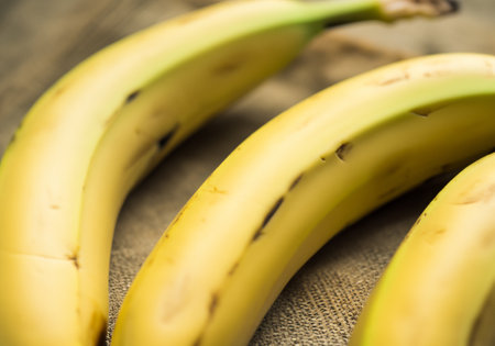 Close up  fresh Raw Organic Bunch of Bananasの素材