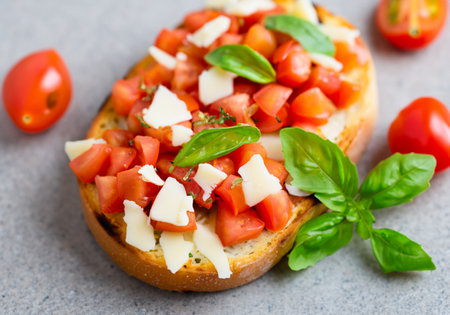 Italian bruschetta with chopped tomatoes, basil and cheeseの素材
