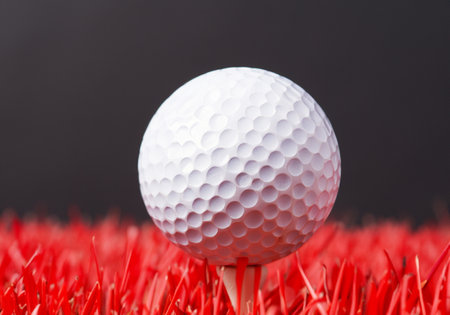 Close Up Of Golf Ball On tee, blur backgroundの素材