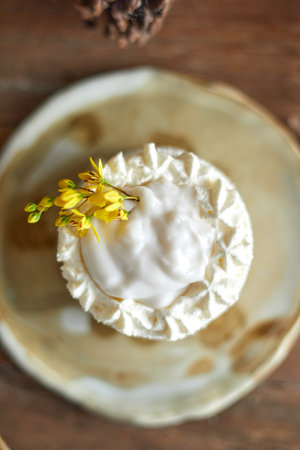 homemake coconut cake on wood backgroundの写真素材