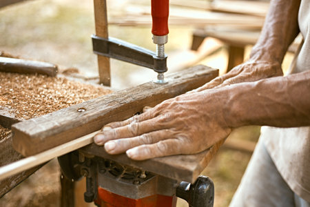 carpenter works on a woodworking machineÂ 