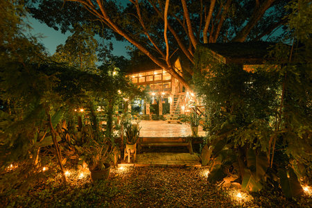 wooden cottage house at night,chiang rai,thailandの写真素材