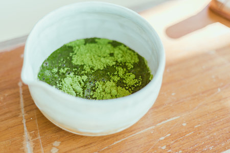 Close up matcha green tea powder in a bowlの写真素材