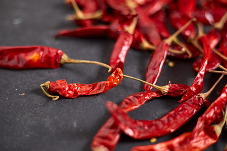 Dried chilli peppers on rustic dark backgroundの写真素材