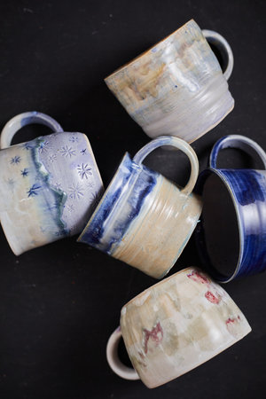 Ceramic cup on rustic background, studio lightの写真素材