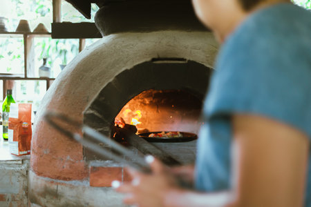 pizza traditional oven in open kitchen italian restaurantの写真素材