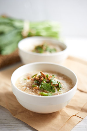 Rice porridge with minced pork on white Background.の写真素材