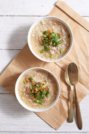 Rice porridge with minced pork on white Background.の写真素材