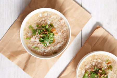 Rice porridge with minced pork on white Background.の写真素材