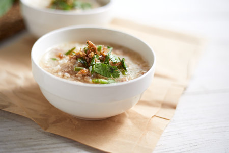Rice porridge with minced pork on white Background.の写真素材