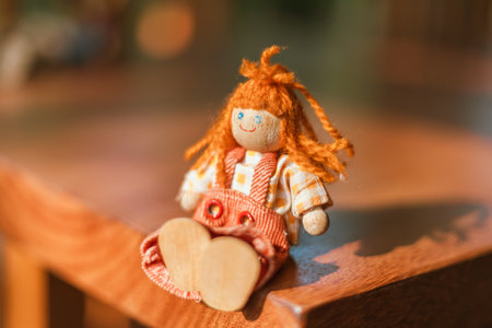 handmade wooden doll on blur background.の写真素材