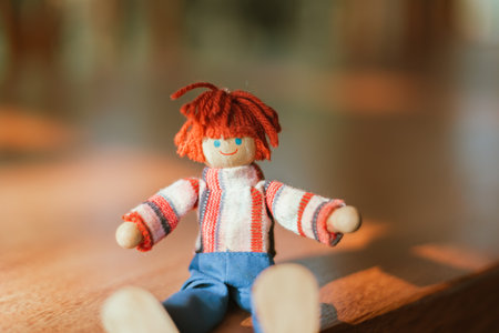 handmade wooden doll on blur background.の写真素材