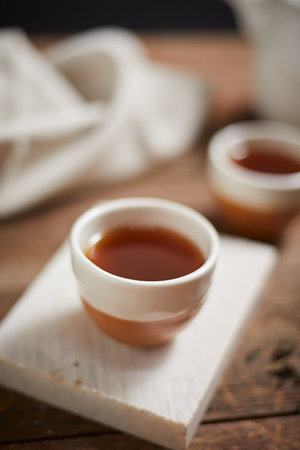 Close up hot tea on a rustic wood backgroundの写真素材