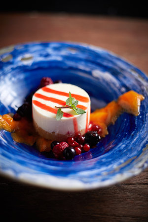 Close up Mix berry cheese cake ,Beautiful and tasty food on a plate, exquisite dish, creative restaurant meal conceptの写真素材