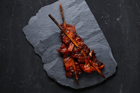 Grilled Chicken Street food in Thai style on dark background.の写真素材