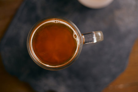 Close up mug of beer on wooden tableの写真素材