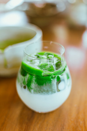Close up iced matcha latte tea with milk.の写真素材