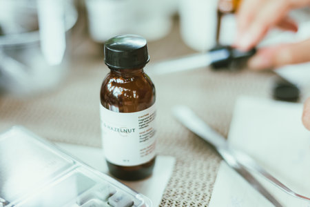 Shot of mature perfumer adding extra essential oil, perfume sampleの写真素材