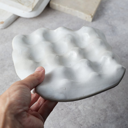 Close up ceramic tray on gray background.の写真素材