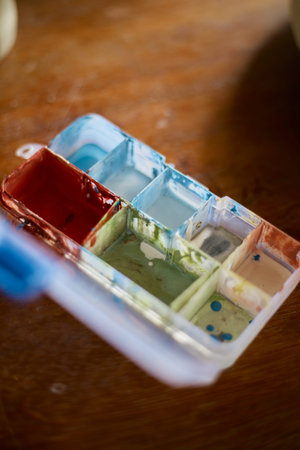 artist's palette, texture mixed ceramic paints in different colors