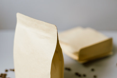 Brown kraft paper coffee bag on gray background.の写真素材
