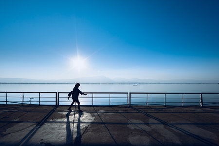 Beautiful scenery at Kwan Phayao Lake in Thailand, light of the sun reflects on the water wavesの写真素材