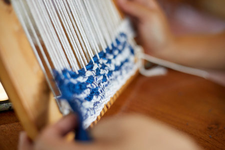 Weaving on a loom frame, traditional crafts
