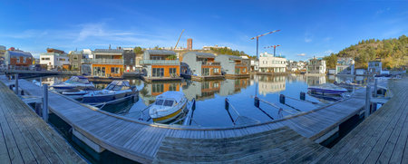 Stockholm, Sweden - October 8 , 2021: Special panorama view of marina in Stockholm with houseboats...